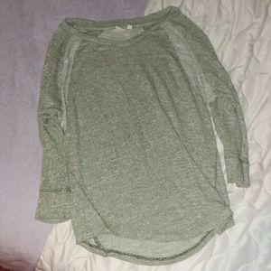 A light greenish grey sweater.